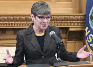 Kansas, Governor Laura Kelly, Medicaid, protst, banners, blood on their hands, Kansas Statehouse