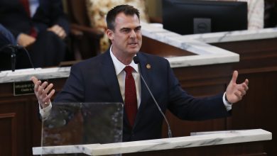 Photo of Gov. Stitt Under Fire Over Twitter Photo