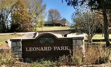 Photo of One Joplin to celebrate ribbon cutting for a new StoryWalk® installation at Leonard Park