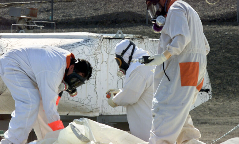 Toxic waste waist hazmat suit hazard hazardous chemical chemicals spill spills danger