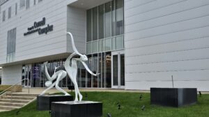 Repairs being made to sculpture outside the Cornell Center